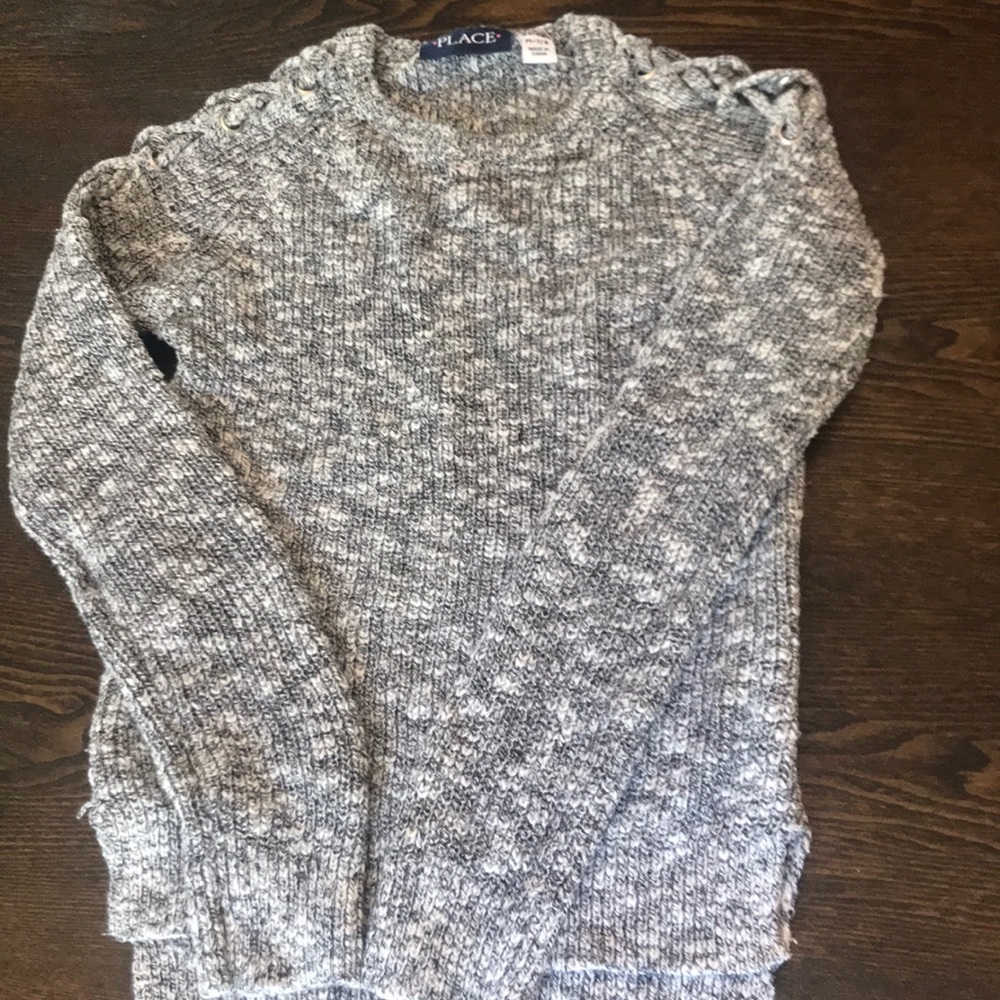 Grey sweater laced on the shoulders